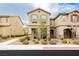 Charming two-story home featuring a well-manicured lawn, desert landscaping and neutral colors at 2871 Cabrillo Terrace St, Henderson, NV 89044