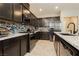 Well-equipped kitchen with stainless steel appliances, granite counters and tile backsplash at 2871 Cabrillo Terrace St, Henderson, NV 89044