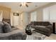 Comfortable living room offers gray sofas and large windows with bright, natural light at 2871 Cabrillo Terrace St, Henderson, NV 89044