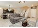 Open-concept living room featuring neutral tones and views into the kitchen at 2871 Cabrillo Terrace St, Henderson, NV 89044