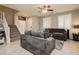 Inviting living room features tile floors, ceiling fan, and natural light from the large window at 2871 Cabrillo Terrace St, Henderson, NV 89044