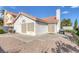 Enclosed backyard with a grill, concrete patio, gravel landscaping, and low-maintenance features at 301 Montcliff Ave, Henderson, NV 89074