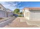 Spacious backyard featuring gravel landscaping and a concrete patio area at 301 Montcliff Ave, Henderson, NV 89074