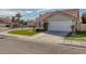 Pleasant single-story home featuring well-kept lawn, a two-car garage and stucco siding at 301 Montcliff Ave, Henderson, NV 89074