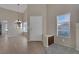 Open foyer with hardwood floors, lots of natural light and a view of the adjacent living spaces at 301 Montcliff Ave, Henderson, NV 89074