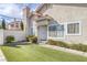 Inviting front entrance with a white door, artificial lawn and well-maintained landscaping at 301 Montcliff Ave, Henderson, NV 89074