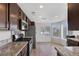 Contemporary kitchen with stainless steel appliances, granite countertops, and wood flooring at 301 Montcliff Ave, Henderson, NV 89074