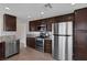 Fully equipped kitchen features stainless steel appliances and granite countertops at 301 Montcliff Ave, Henderson, NV 89074