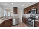 Well-appointed kitchen with stainless steel appliances and granite countertops at 301 Montcliff Ave, Henderson, NV 89074