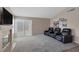 Bright living room with a fireplace, sliding glass door and comfortable leather recliners at 301 Montcliff Ave, Henderson, NV 89074