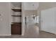Inviting living room with wood-style flooring and built-in shelving, perfect for showcasing decor at 301 Montcliff Ave, Henderson, NV 89074