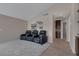 Spacious living room with plush carpet, vaulted ceiling and comfortable leather recliners at 301 Montcliff Ave, Henderson, NV 89074