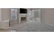 Cozy living room featuring a fireplace, sliding glass door and neutral carpeting at 301 Montcliff Ave, Henderson, NV 89074