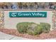 Green Valley neighborhood sign with a decorative rock border and mature shrubbery in front at 301 Montcliff Ave, Henderson, NV 89074