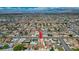The home is in a quiet suburban neighborhood with easy access to city amenities at 325 Greenfield Ln, Las Vegas, NV 89107