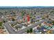 An aerial view of a single story home in a residential community near the Las Vegas city skyline at 325 Greenfield Ln, Las Vegas, NV 89107