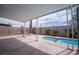 A backyard oasis with a covered patio and a swimming pool at 325 Greenfield Ln, Las Vegas, NV 89107