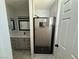 Stylish bathroom featuring gray vanity and modern shower with marble wall tiles at 325 Greenfield Ln, Las Vegas, NV 89107