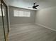 This bedroom features vinyl floors, ceiling fan and a sliding door closet at 325 Greenfield Ln, Las Vegas, NV 89107