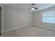This bedroom offers wood floors and a modern ceiling fan at 325 Greenfield Ln, Las Vegas, NV 89107