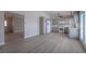 Open kitchen featuring gray cabinets and stainless appliances with new vinyl flooring at 325 Greenfield Ln, Las Vegas, NV 89107