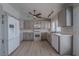 Well-lit kitchen featuring gray cabinets, stainless appliances, and white countertops at 325 Greenfield Ln, Las Vegas, NV 89107