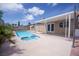Relax and unwind in this spacious backyard with a pristine swimming pool and spa at 325 Greenfield Ln, Las Vegas, NV 89107