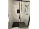 Beautiful shower featuring marble wall tiles, black hardware and a glass sliding door at 325 Greenfield Ln, Las Vegas, NV 89107