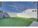 A spacious backyard featuring well-maintained artificial grass, offering a low-maintenance outdoor space for relaxation at 3264 Monte Luna Ave, Henderson, NV 89044