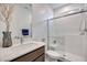 Contemporary bathroom with a glass-enclosed shower, single sink vanity, and modern fixtures at 3264 Monte Luna Ave, Henderson, NV 89044