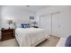 Cozy bedroom showcasing a comfortable bed, matching nightstands, and closet with sliding doors at 3264 Monte Luna Ave, Henderson, NV 89044