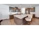 Modern kitchen with wooden cabinets, stainless steel appliances, and granite countertops with barstool seating at 3264 Monte Luna Ave, Henderson, NV 89044