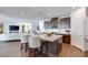 Modern kitchen with island, barstool seating, stainless appliances, and wood cabinets at 3264 Monte Luna Ave, Henderson, NV 89044