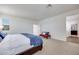 Spacious main bedroom featuring a large bed, carpet, and light-filled windows at 3264 Monte Luna Ave, Henderson, NV 89044