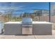 This outdoor cooking area has a stainless steel grill, countertop and two sinks under a clear blue sky at 3264 Monte Luna Ave, Henderson, NV 89044