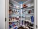 Walk-in pantry with white shelves, filled with groceries, cookware, and small appliances at 3264 Monte Luna Ave, Henderson, NV 89044