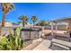 Large backyard with desert landscaping, covered patio, above-ground pool, solar panels and seating, perfect for outdoor gatherings at 3700 Hedge Grove Dr, North Las Vegas, NV 89032