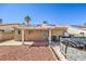 This backyard includes solar panels, desert landscaping, a covered patio, and an above-ground pool, perfect for entertaining at 3700 Hedge Grove Dr, North Las Vegas, NV 89032