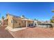 Charming home exterior featuring solar panels, a covered patio, desert landscaping, and an above ground pool, ready for relaxation at 3700 Hedge Grove Dr, North Las Vegas, NV 89032