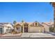 Charming single-story home with a well-maintained lawn and desert landscaping in a sunny neighborhood at 3700 Hedge Grove Dr, North Las Vegas, NV 89032