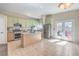 Bright kitchen featuring an island, stainless steel appliances, and tile floors at 3700 Hedge Grove Dr, North Las Vegas, NV 89032