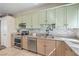 Well-lit kitchen featuring tile floors, granite countertops and stainless steel appliances at 3700 Hedge Grove Dr, North Las Vegas, NV 89032