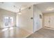 Bright, open interior showcasing tile flooring, French doors, and a cozy living area at 3700 Hedge Grove Dr, North Las Vegas, NV 89032