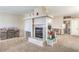 Spacious living room with a fireplace, neutral paint, and plush carpeting at 3700 Hedge Grove Dr, North Las Vegas, NV 89032