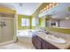 Bathroom featuring a garden tub, shower, double vanity, and decorative lighting at 3700 Hedge Grove Dr, North Las Vegas, NV 89032