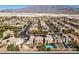 Desert community with stunning mountain views, modern homes, solar panels, and a beautiful blue sky at 3829 Hawkeye Falls Ave, North Las Vegas, NV 89085