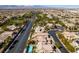 Aerial view of the neighborhood showcasing the lush landscaping and community amenities, including a golf course at 3829 Hawkeye Falls Ave, North Las Vegas, NV 89085