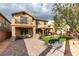 A well-manicured backyard featuring a gazebo, patio furniture, egg chair, and plenty of room at 3829 Hawkeye Falls Ave, North Las Vegas, NV 89085