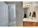 This is a brightly lit bathroom with a shower and vanity with a single sink at 3829 Hawkeye Falls Ave, North Las Vegas, NV 89085