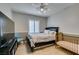 Comfortable bedroom featuring a ceiling fan and bright natural light, and adjoining crib at 3829 Hawkeye Falls Ave, North Las Vegas, NV 89085